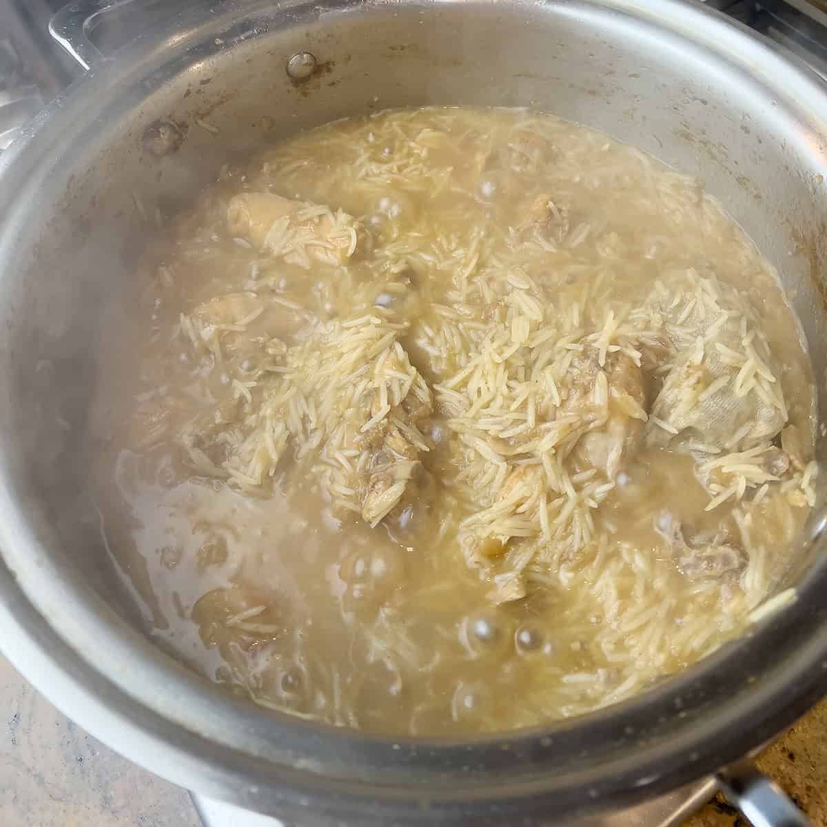 Chicken pulao being cooked.
