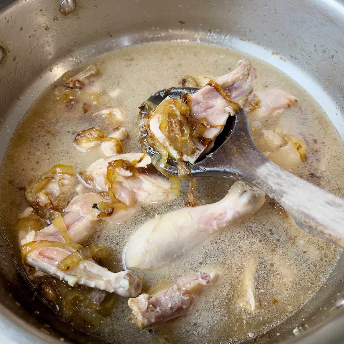 Chicken yakhni being prepared for a pulao recipe.