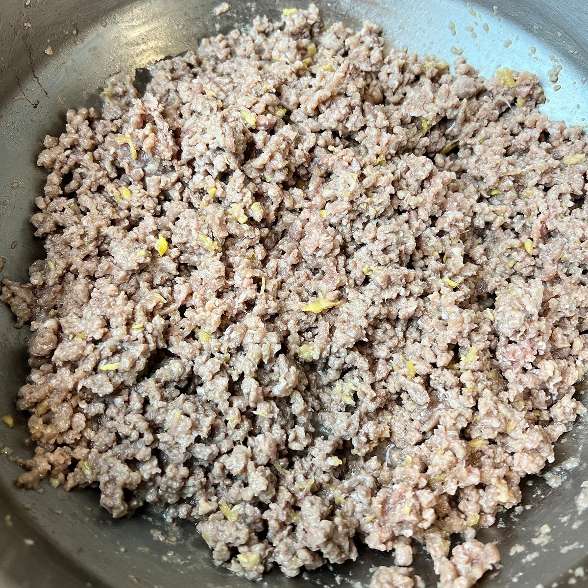 Ground beef being cooked in a pot.