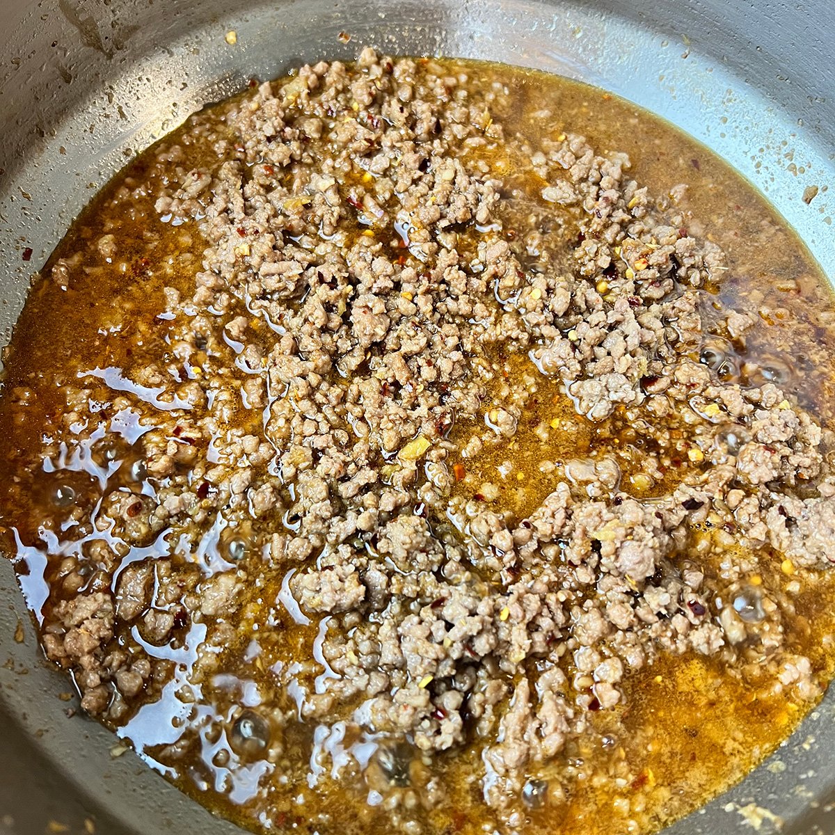Cooked ground beef.