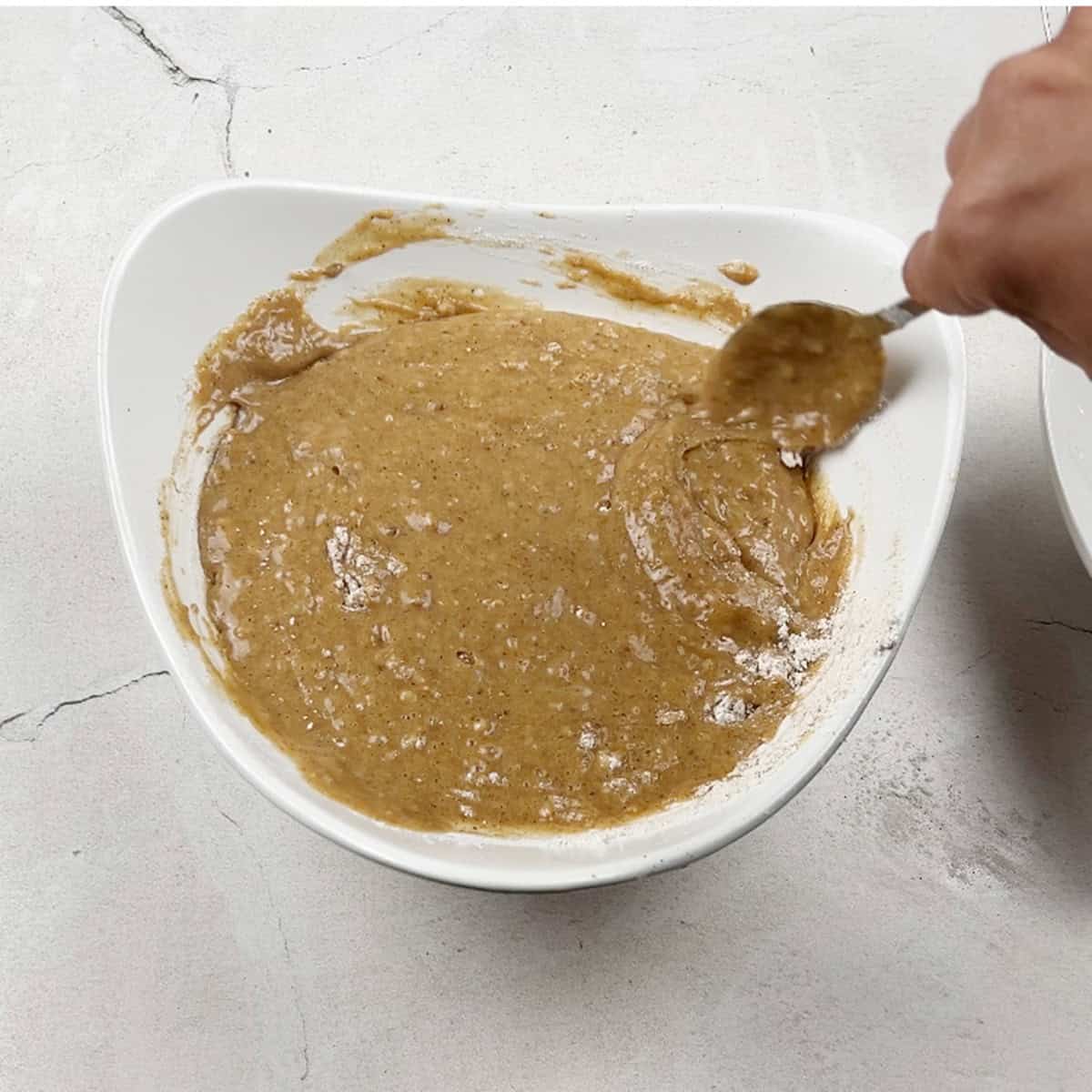 A batter for mini bundt cakes is being mixed.