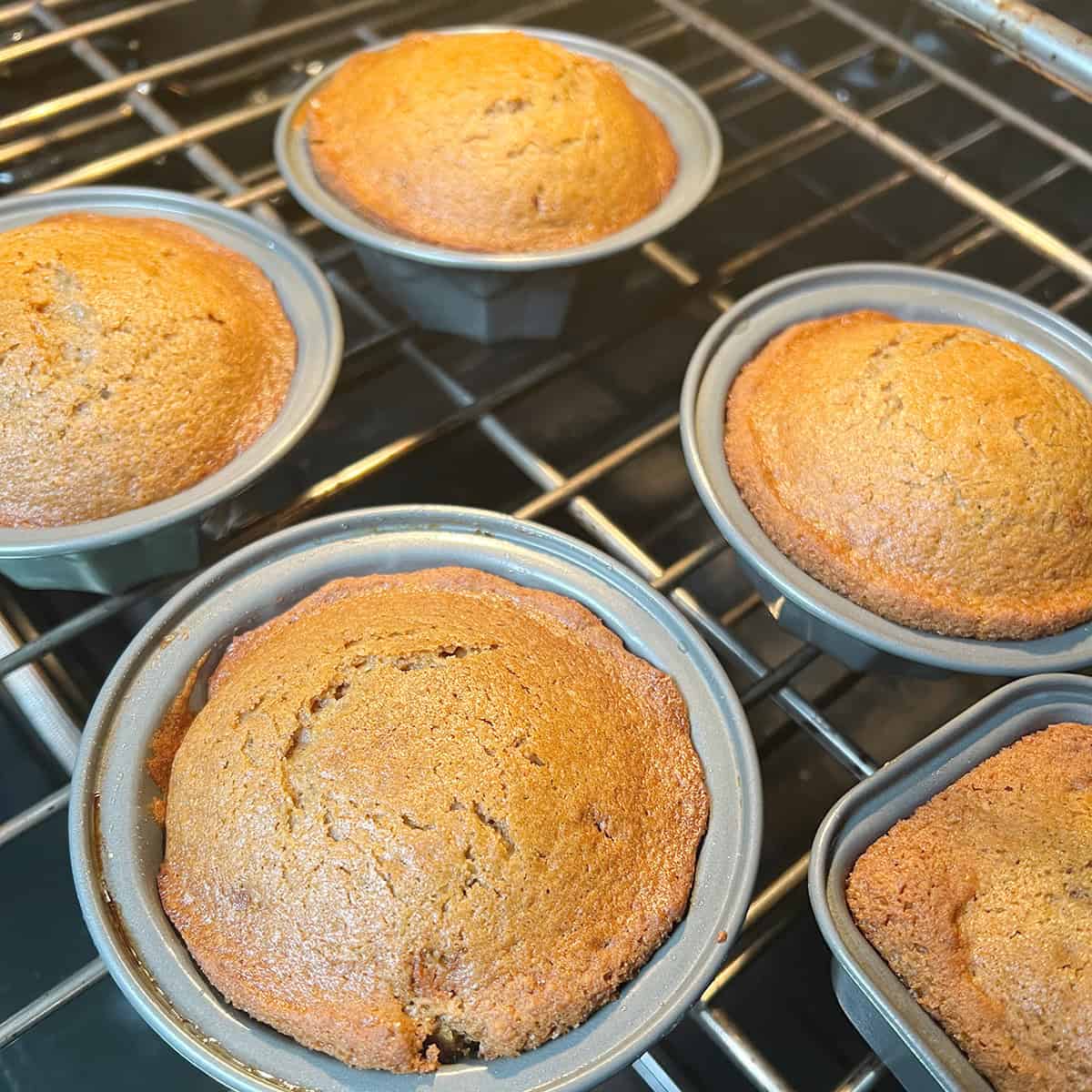 Mini bundt cakes baking in the oven.