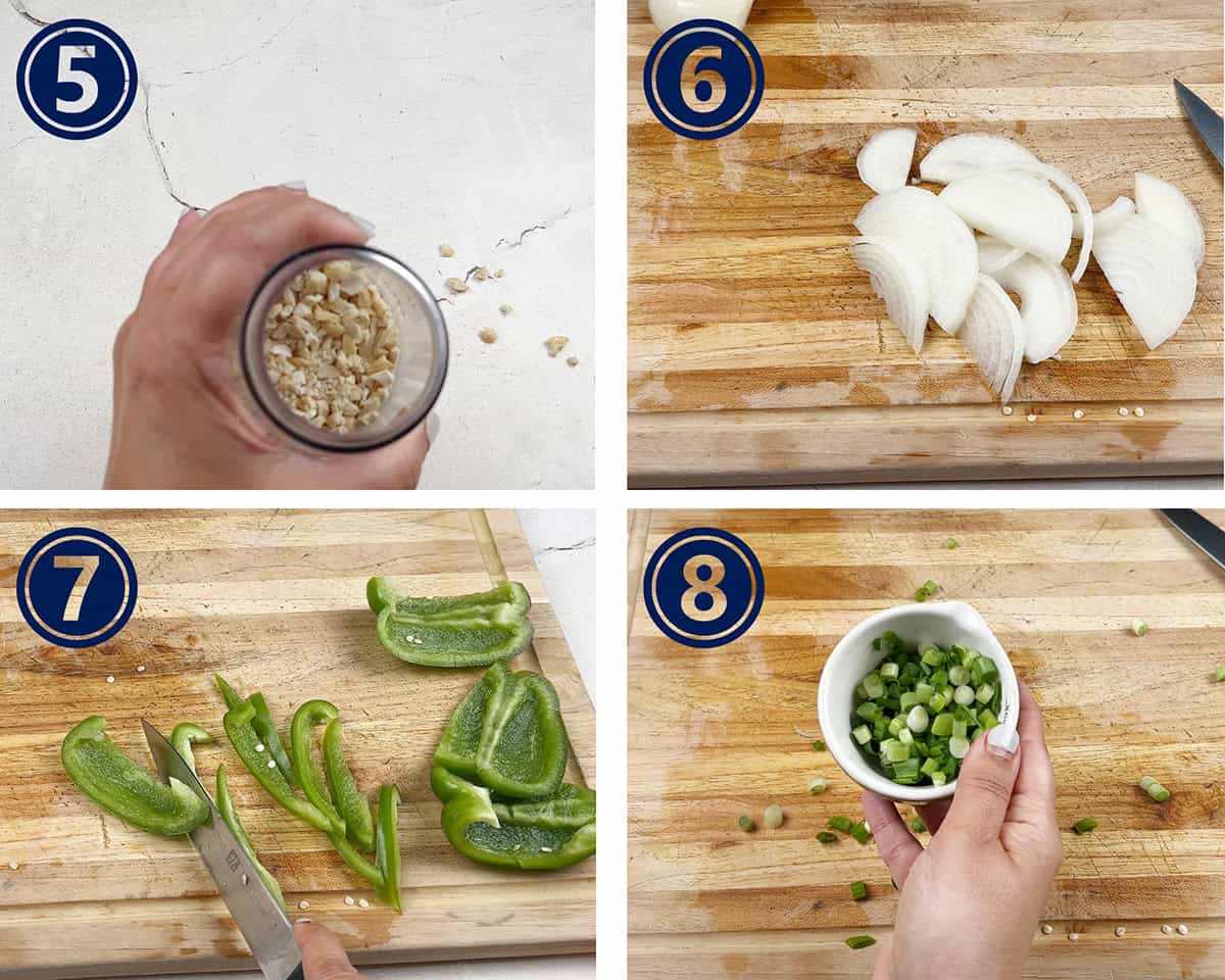 Cashew nuts are being chopped and vegetables sliced for a recipe.