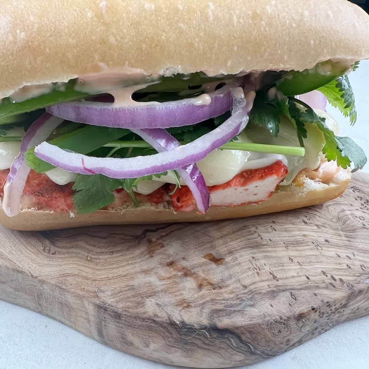Freshly prepared chicken sandwich.