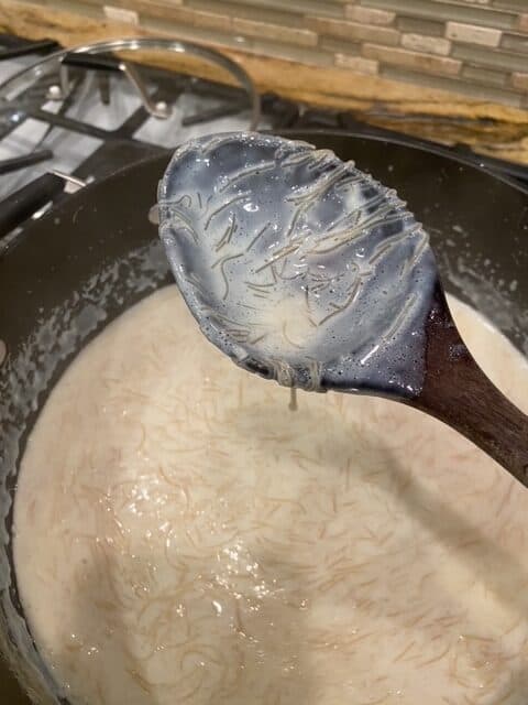 thick enough to coat the spoon