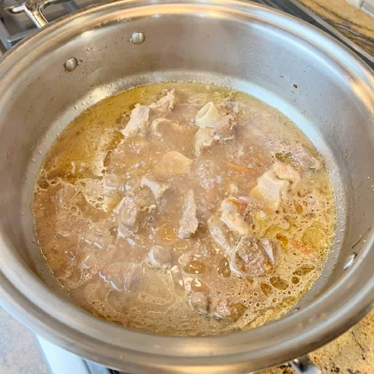 Aloo gosht being cooked.