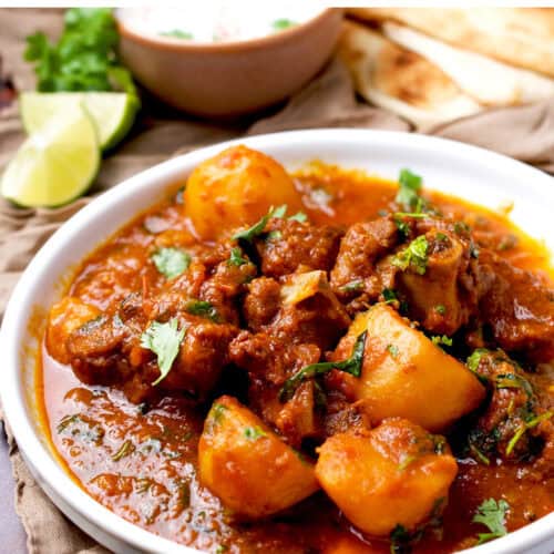 Plated Pakistani meat and potato curry.