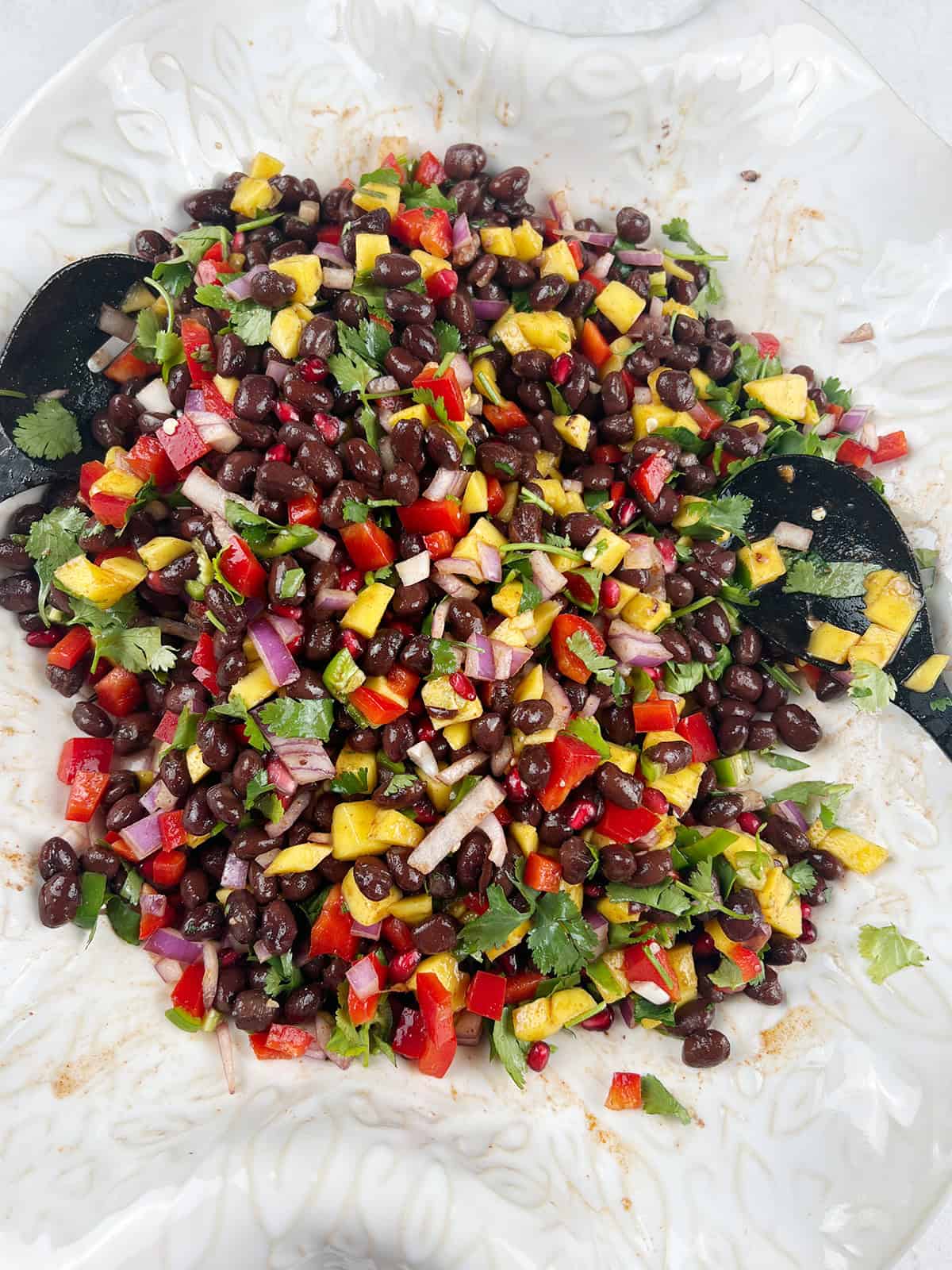 Freshly mixed summer salad with black beans.