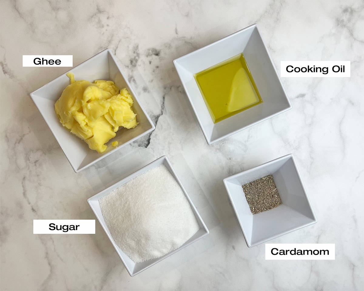 Measured ingredients for a pethay ka halwa are resting on a white kitchen counter.