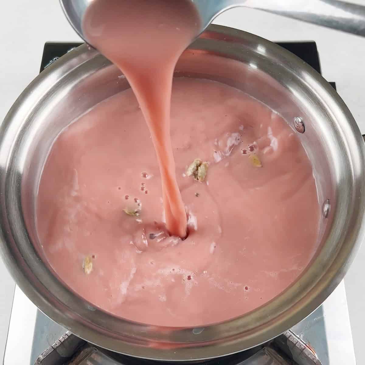 Noon chai is being boiled with milk and cardamom.