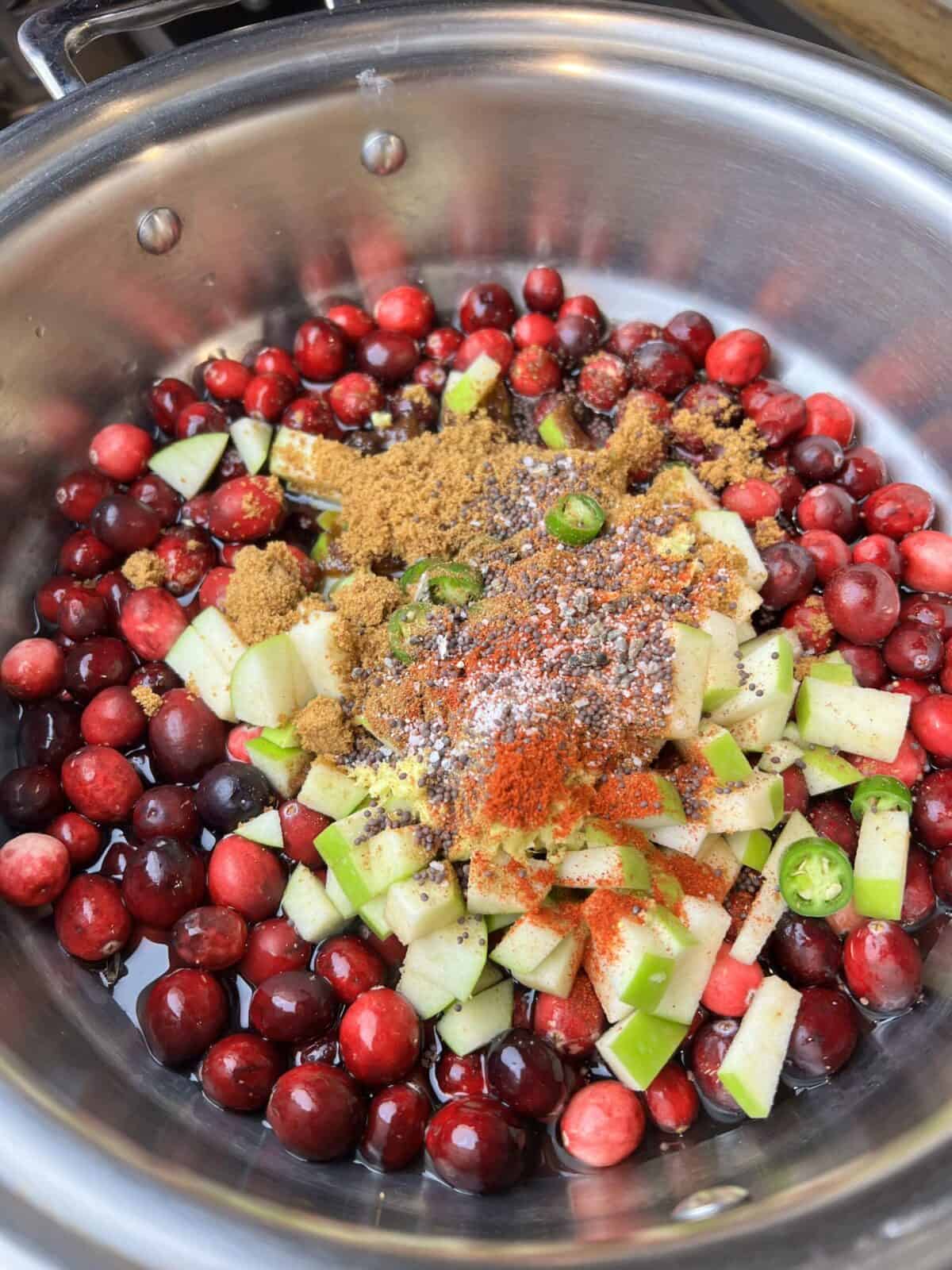 Add in spices to the cranberry chutney