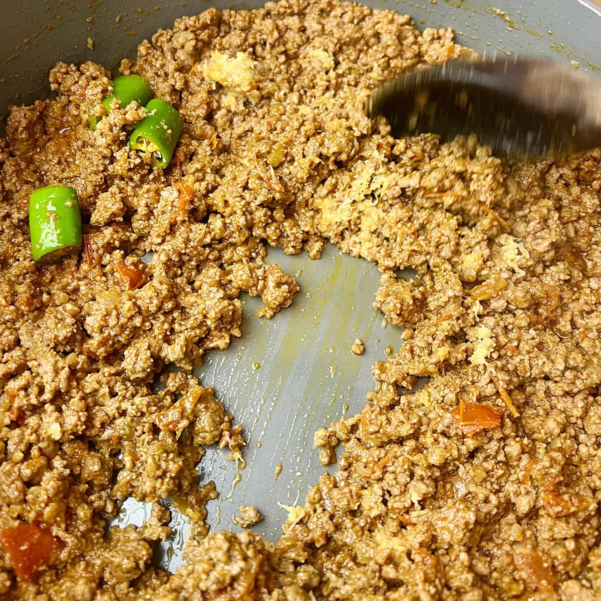 Ground beef curry being cooked.