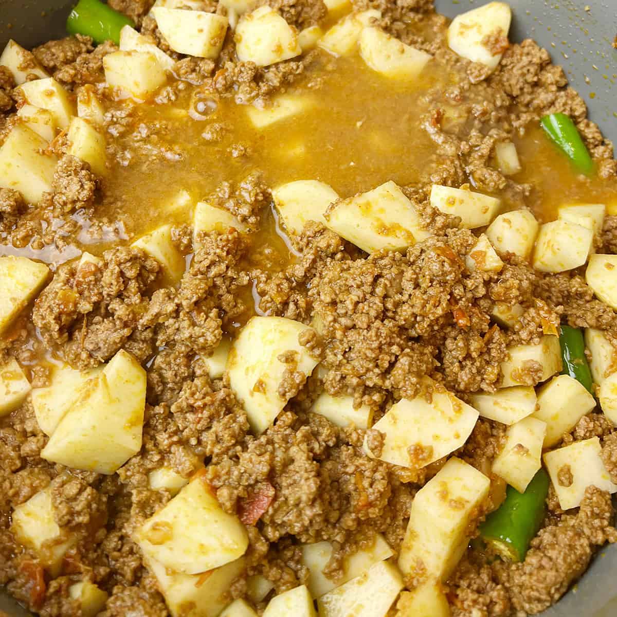 aloo keema recipe being cooked.