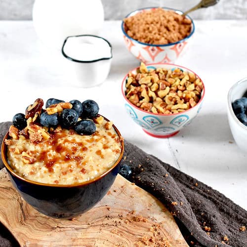 Pakistani oatmeal, cooked with milk and jaggery, and topped with blueberries and walnuts.