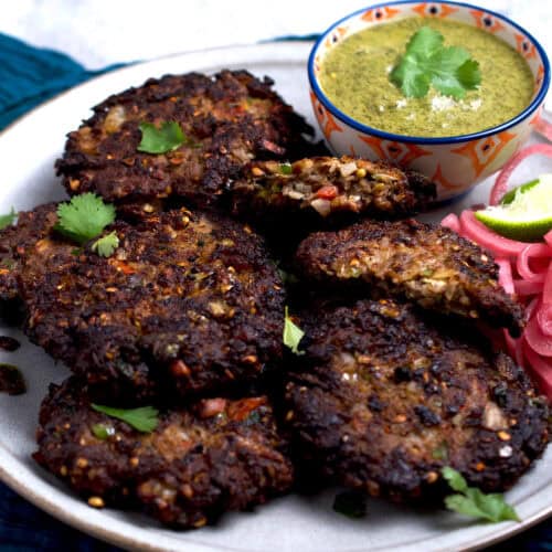 Peshawari-style kabab with a side of chutney and onions.