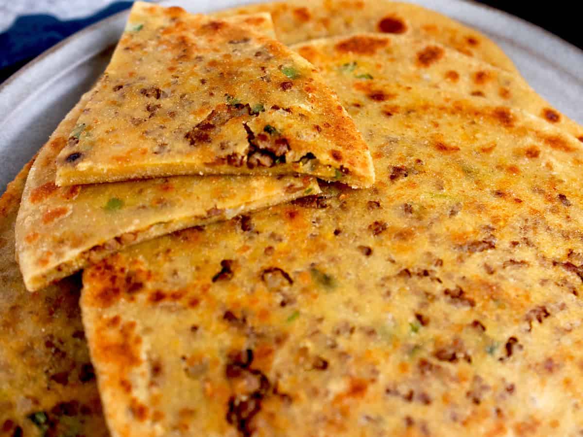 A traditional Pakistani flatbread stuffed with spiced ground beef.