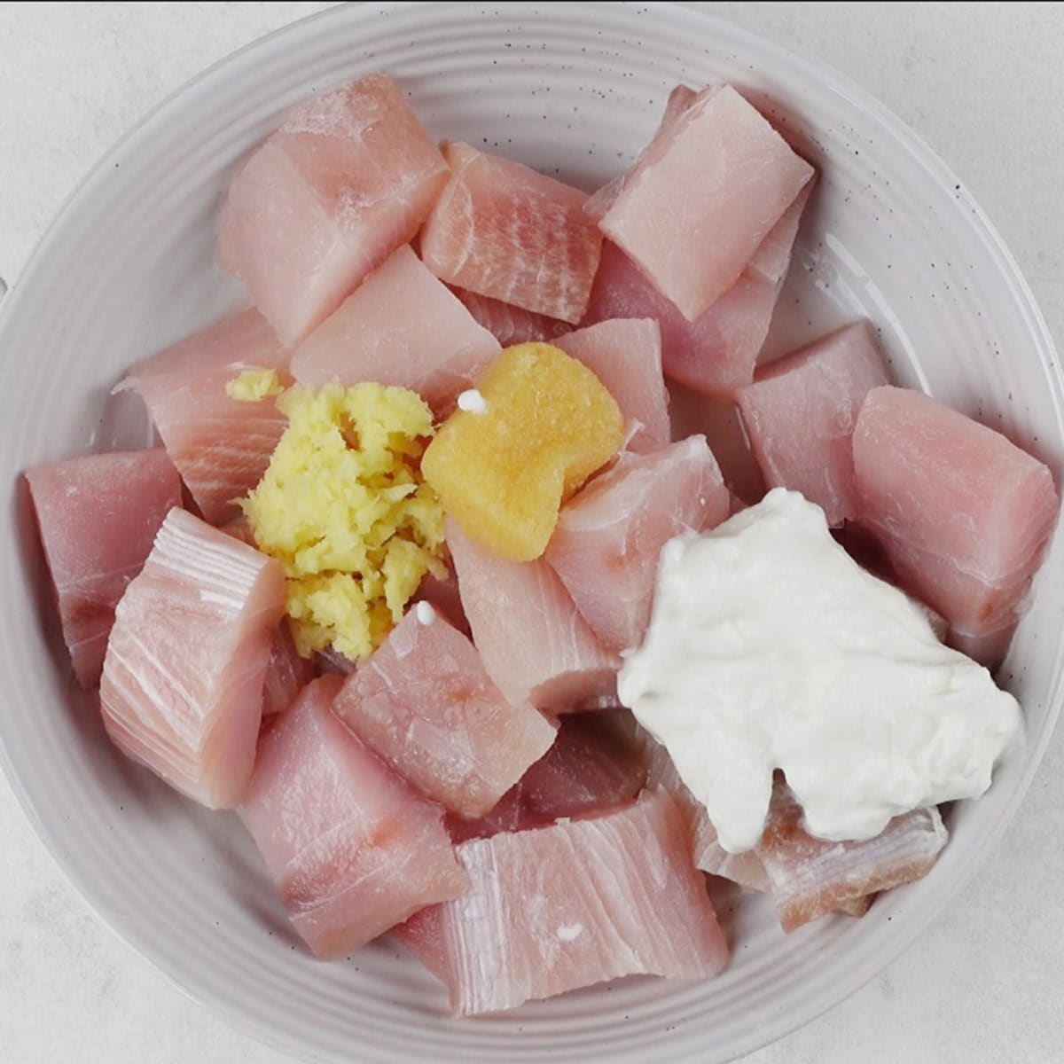 fish being marinated for a recipe.