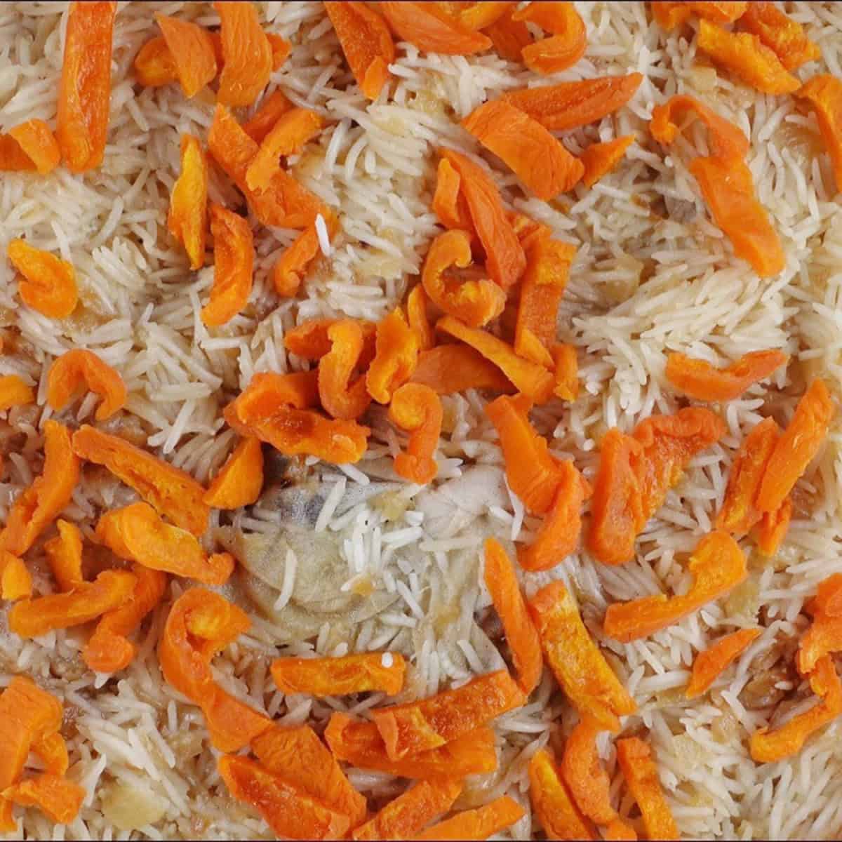Pulao garnished with dried apricots.
