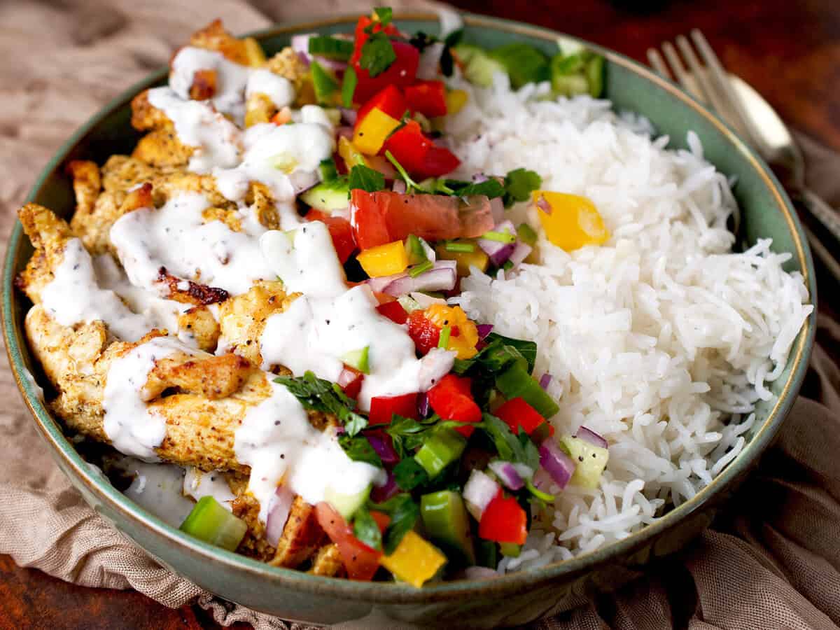 A middle eastern chicken and rice bowl.