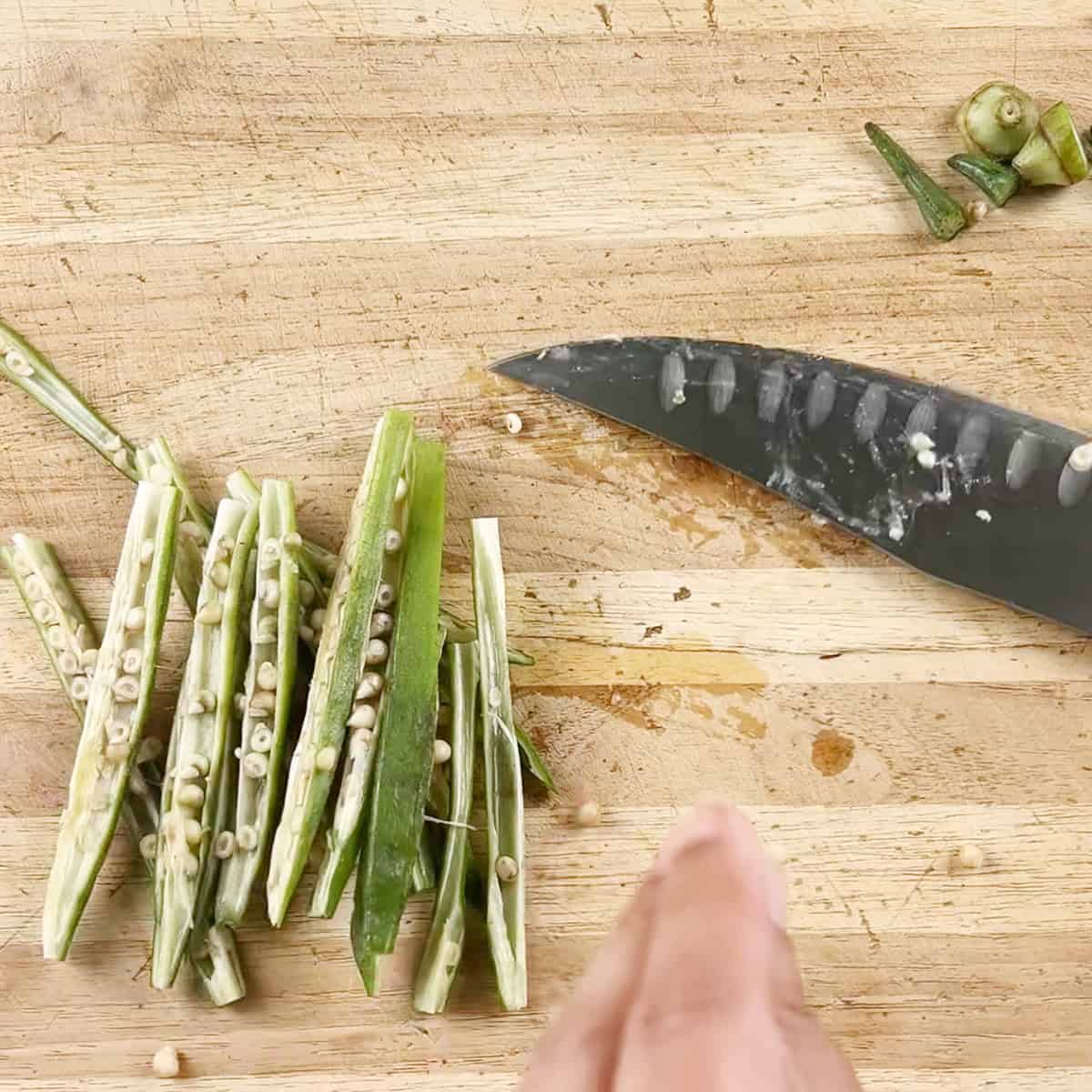 Okra being cut for a recipe.