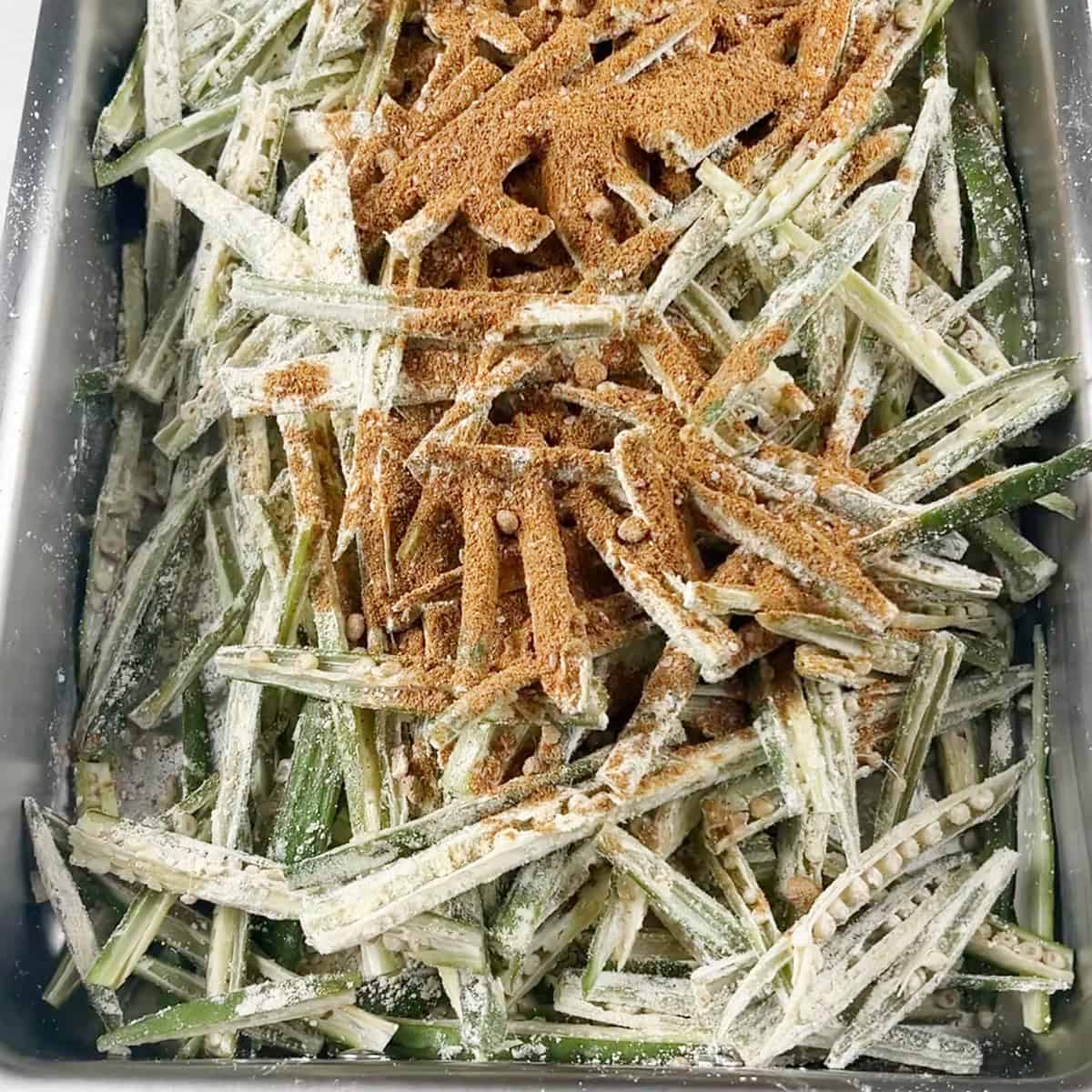 kurkuri bhindi is being prepped for the air fryer.