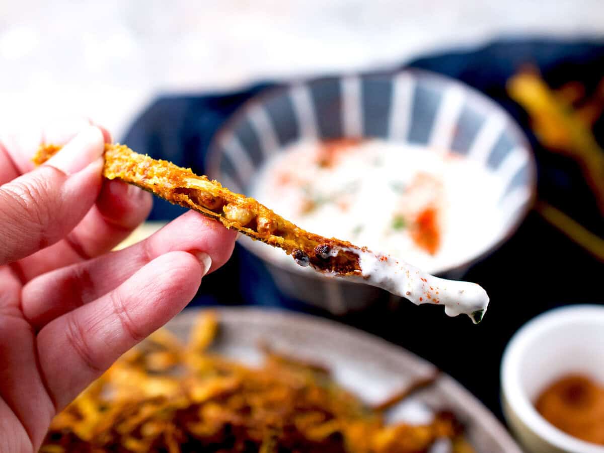 Crispy okra dipped in raita.
