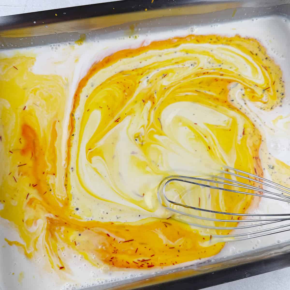 Saffron kulfi being prepared.