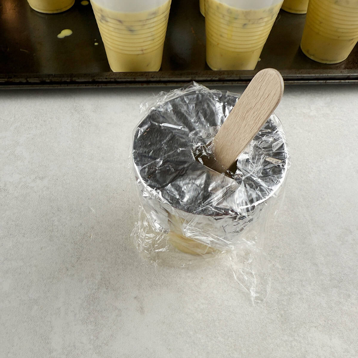 Malai kulfi in a mold ready to be frozen.